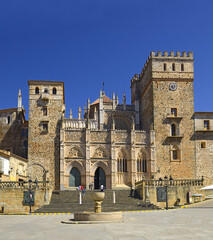 Mudejar cloister, Royal Monastery of Santa Maria de Guadalupe, province of Caceres, Extremadura, Spain - UNESCO World Heritage Site. Overview of the main facade and the square