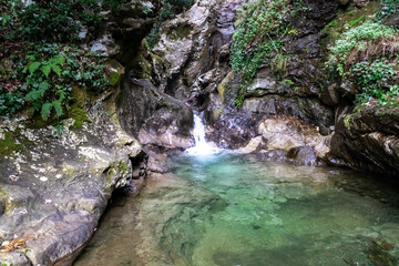 River creating a turquoise pond next to the Path of the Gods (Sentiero Degli Dei) on the Amalfi...