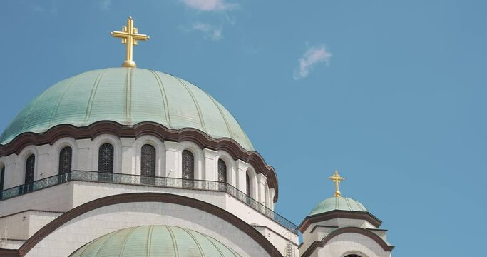 a large Orthodox church with domes and a golden cross