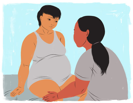 Doula comforting mother during early childbirth labor