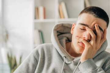 portrait of young teenager with bored or overwhelmed expression