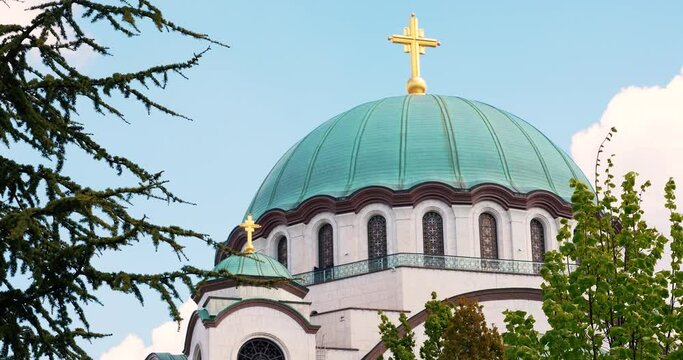 an Orthodox church in white marble and a large cross