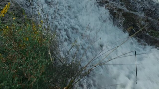 Beautiful large waterfall in a slow motion.