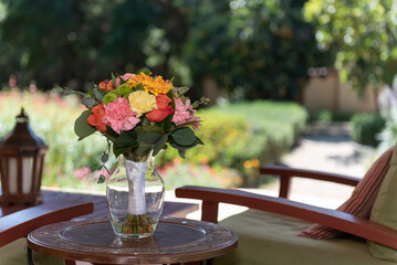 Bridal bouquet arranged in beautiful colors and sitting in a vase before the wedding ceremony