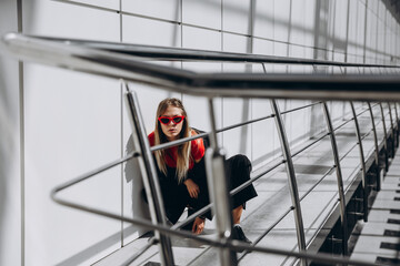 The person is sitting on the floor.