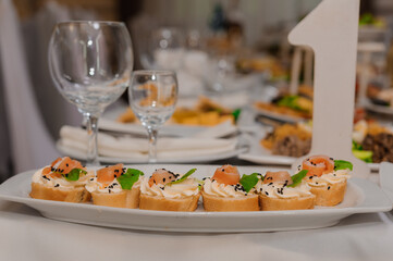 canape with salmon, cream cheese and herbs