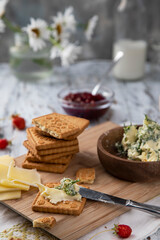 Dill butter, biscuits and cheese on a rustic morning table