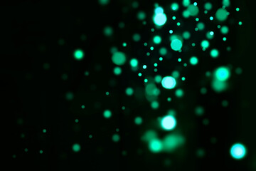 Festive golden luminous background with lights bokeh. Abstract glowing bokeh lights