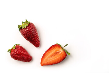 Red, fresh, ripe early strawberries isolated on a white background with clipping path included