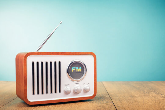 Retro old FM radio front mint blue background. Vintage style filtered photo