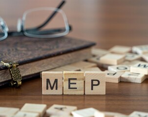 the acronym mep for member of the european parliament word or concept represented by wooden letter...