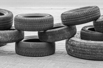 Lots of car tires. Barricade with wheels. Car tire tread. Fence with tires. Checkpoint with...