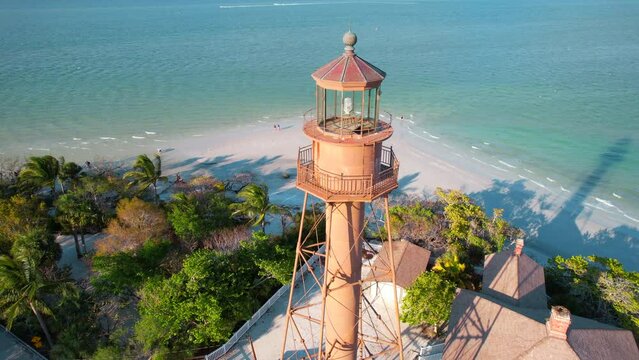 Lighthouse. Florida beach. Panorama of Sanibel island in Lee County FL. Spring or Summer vacations in USA. Blue-turquoise color of salt water. Ocean or Gulf of Mexico. Tropical Nature. Aerial view.