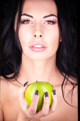 Halloween. A terrible wicked witch holds a poisoned apple in her hands, standing in her lair among...