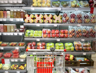 buying vegetables and fruits  at the market.empty grocery cart in an empty supermarket