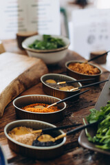food ingredients, spices and herbs on a wooden table