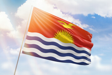 Sunny blue sky and a flagpole with the flag of kiribati