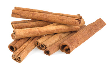 pile of spice cinnamon sticks isolated on white background