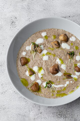 A bowl of Mushroom Cream Soup with fried champignons. Winter, autumn hot soup concept