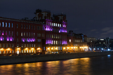 Fototapeta na wymiar Moscow, Russia. Night view of the Moscow river and building of fomer Chocolate Factory 'Red October'. April