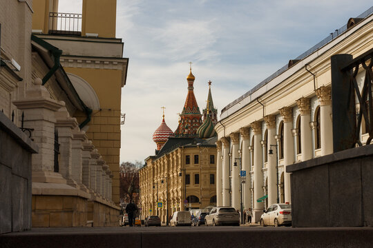 Moscow, Russia, Mar 6, 2022: View of Varvarka street including Gostiny Dvor Exhibition center and St'. Basil's catherdral.