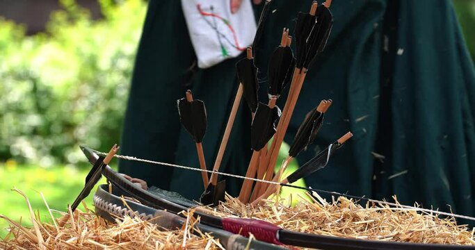 weapons bow and arrow left on a haystack outside