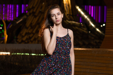 girl against the background of night lights.