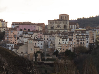 Fototapeta na wymiar Sunrise view of the old town and cathedral of Cuenca, a city declared a World Heritage Site by Unesco