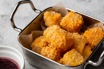 Deep fried Cheese squares served with cranberry sauce. Delicious homemade appetizer.