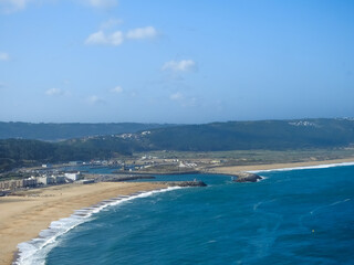 Beach landscape on a sunny day. Nazare, Portugal.