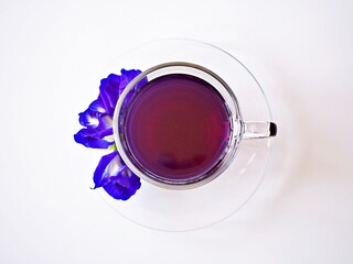 Obraz na płótnie Canvas Cup of tea with blue flowers isolated on white background herb tea