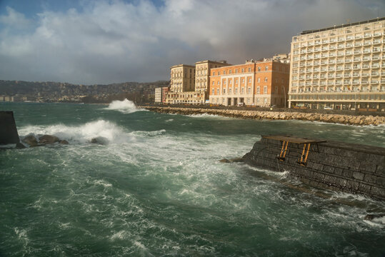 Harbor of Naples, Italy. Storm waves on the medieval Castel dell'Ovo (Egg castle) background.