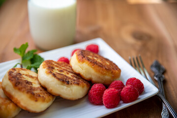 Cheese pancakes with raspberries