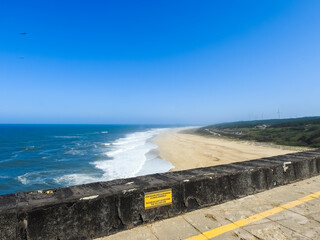 Beach landscape on a sunny day. Nazare, Portugal.