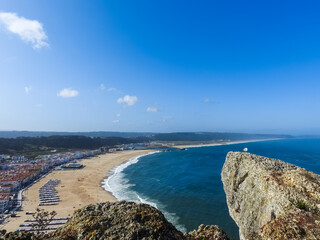 Beach landscape on a sunny day. Nazare, Portugal.