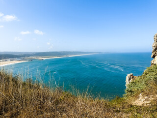 Beach landscape on a sunny day. Nazare, Portugal.