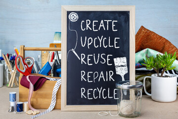 Create upcycle Repair Reuse Recycle sign with tools and fabric, reduce waste for sustainable living...