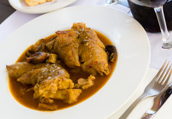 National dish of Catalonia - Pork knuckles and mushrooms in gravy