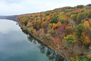 Scenic aerial view of the Cayuga Lake shoreline, near Ithaca NY, with autumn, fall, foliage.