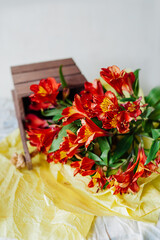 beautiful large bouquet of fresh red flowers. a holiday card. cover for printing. vertical, selective focus