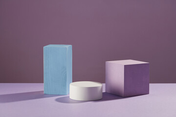 Front view of circle podium decorated in purple background 