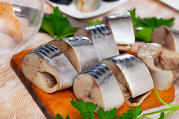 Delicious appetizer - light-salted mackerel on the dining table. High quality photo