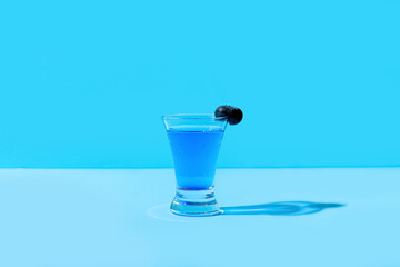 Shot cocktail on color background