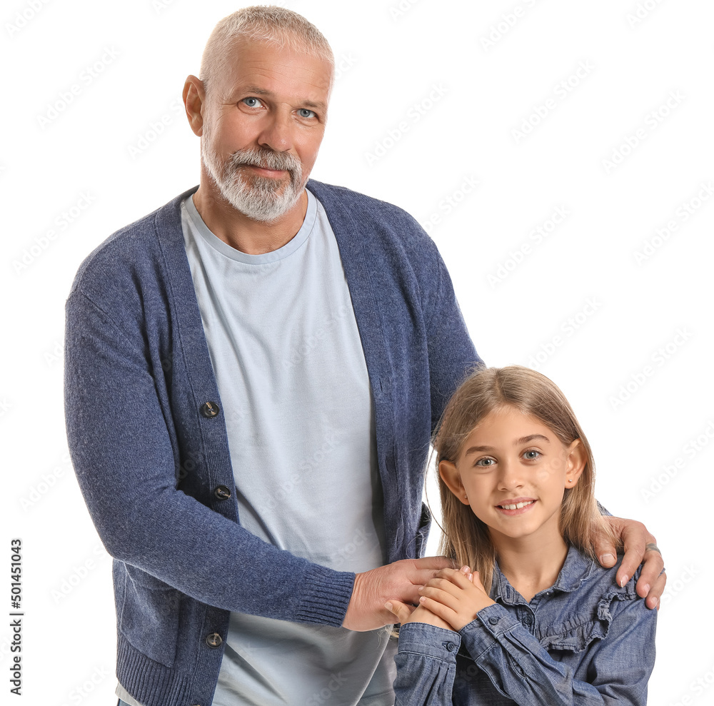 Wall mural senior man with his little granddaughter on white background