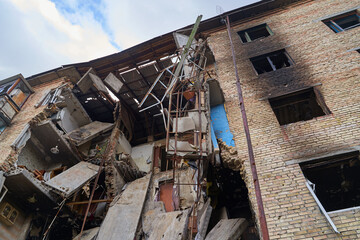 War of Russia against Ukraine. A residential building damaged by an enemy aircraft in the Ukrainian. Consequences of the war, damaged grocery market by the troops of the Russian army.