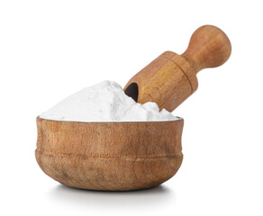Bowl of baking soda and scoop on white background