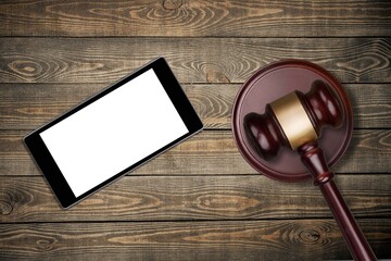 Blank screen seen on a smartphone and judge gavel.