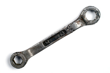 An old wrench on a white background.