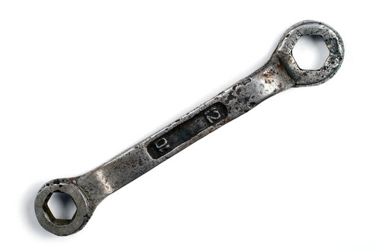 An old wrench on a white background.