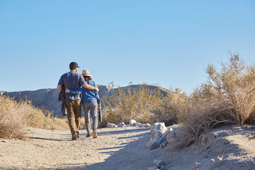 Happy couple hiking through the desert near Palm Springs California